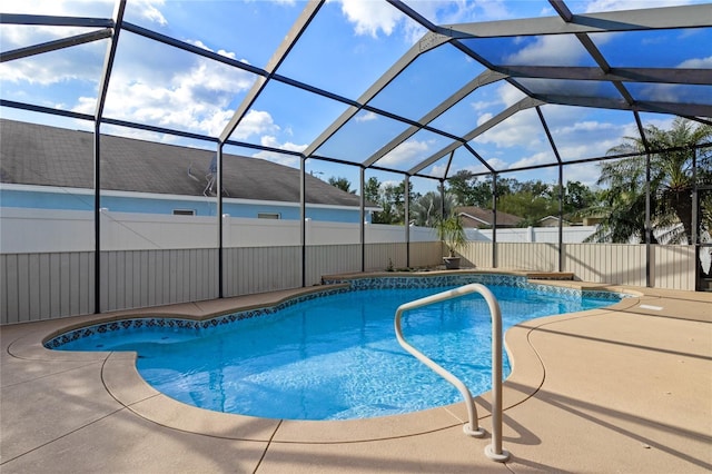 view of pool with a patio area, a fenced in pool, a lanai, and fence