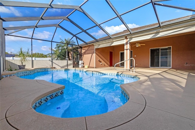 view of swimming pool with a fenced in pool, ceiling fan, fence, a lanai, and a patio