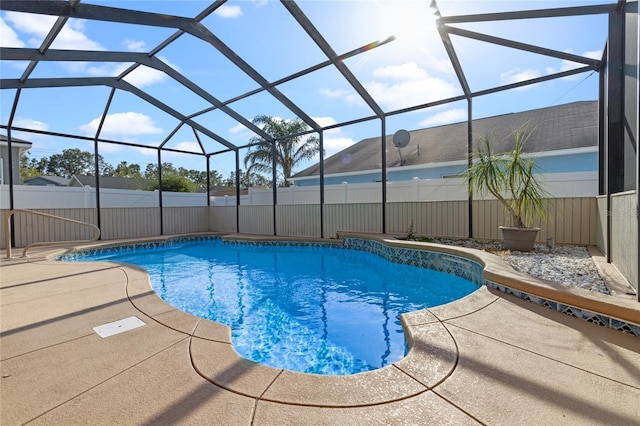 view of swimming pool with a lanai, a fenced in pool, a patio, and a fenced backyard