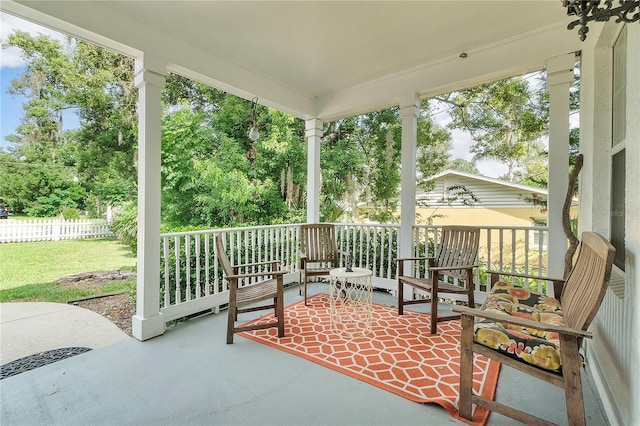 view of patio / terrace featuring fence