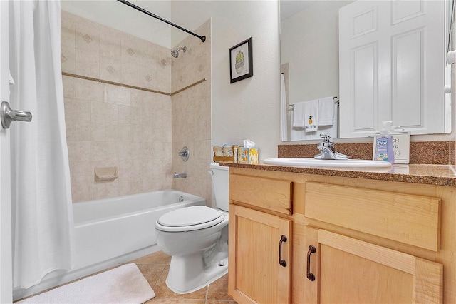 bathroom featuring vanity, tile patterned floors, shower / tub combo, and toilet