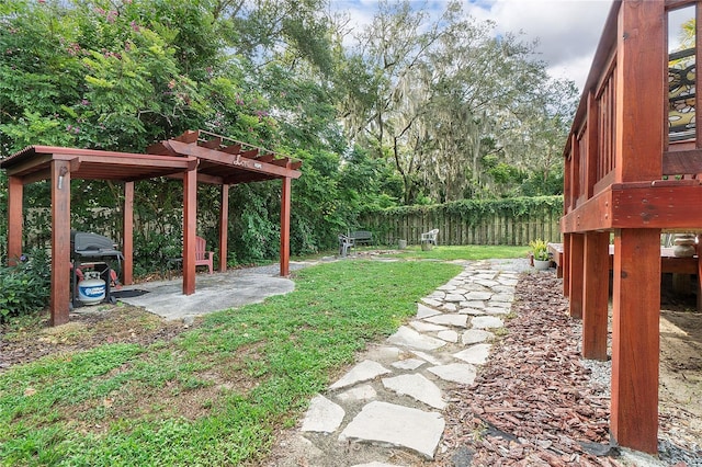 view of yard with a patio and fence