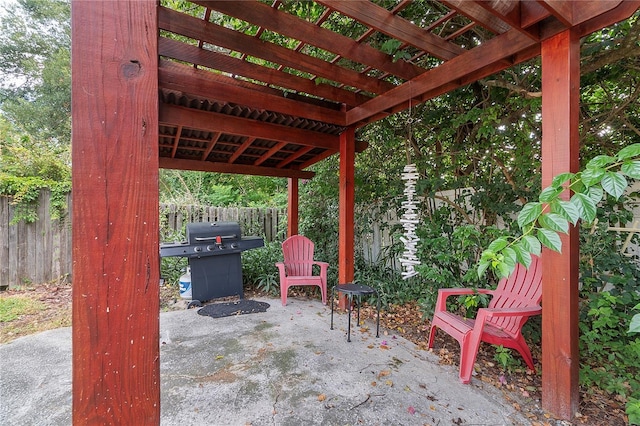 view of patio featuring area for grilling, a fenced backyard, and a pergola