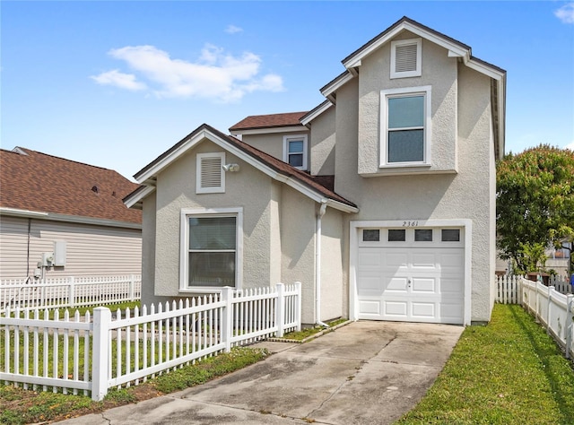 view of front of home featuring concrete driveway, a garage, a fenced front yard, and stucco siding