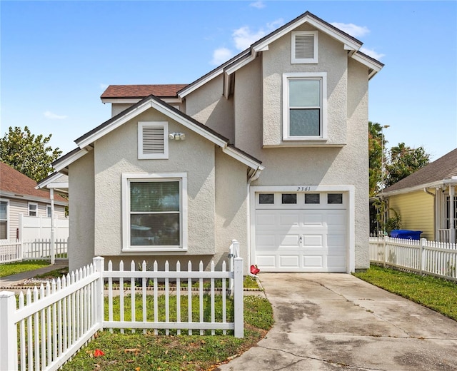 traditional home featuring stucco siding, a garage, a fenced front yard, and concrete driveway