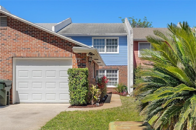 view of front of house featuring brick siding, concrete driveway, a garage, and a shingled roof