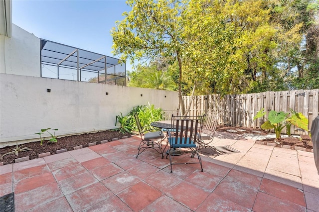 view of patio / terrace with outdoor dining space and a fenced backyard