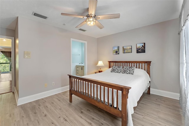 bedroom with visible vents, baseboards, and light wood-style flooring