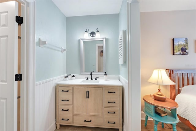 bathroom featuring vanity and wainscoting