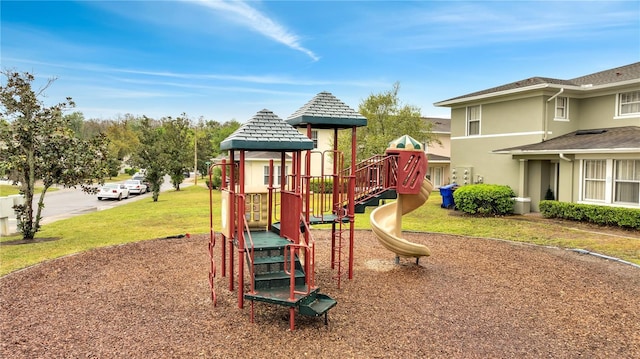 community jungle gym with a lawn