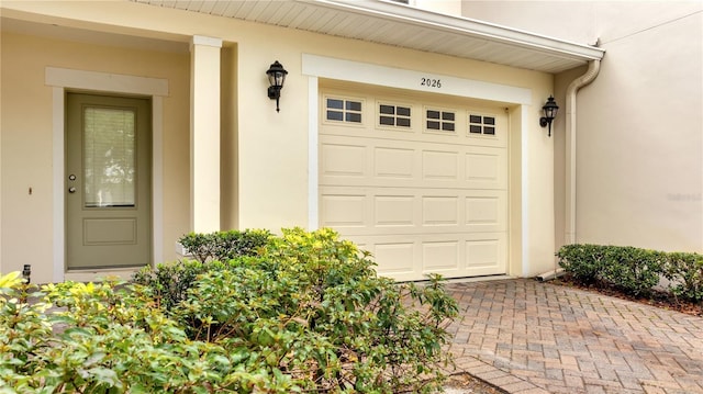 2026 Cypress Bay Blvd, Kissimmee, FL 34743 - garage featuring decorative driveway