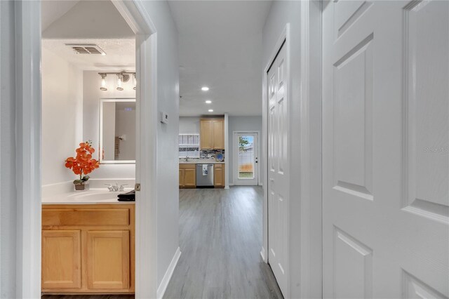 2026 Cypress Bay Blvd, Kissimmee, FL 34743 - hallway with light wood finished floors and recessed lighting