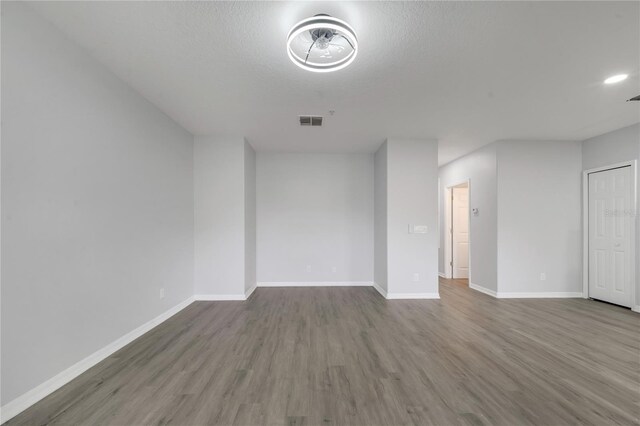 2026 Cypress Bay Blvd, Kissimmee, FL 34743 - unfurnished room with wood finished floors and baseboards