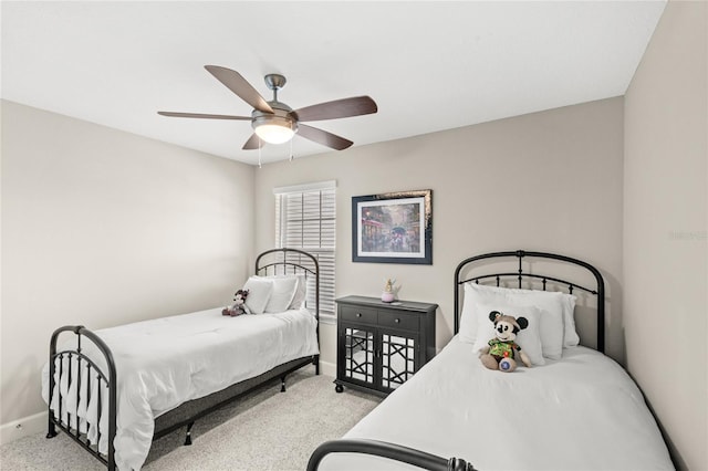 bedroom featuring baseboards, carpet, and ceiling fan