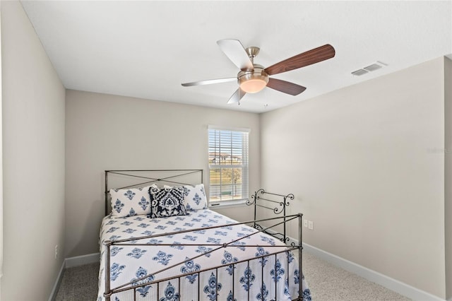 bedroom featuring carpet flooring, baseboards, visible vents, and ceiling fan