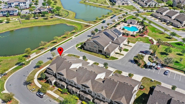 aerial view featuring a residential view and a water view