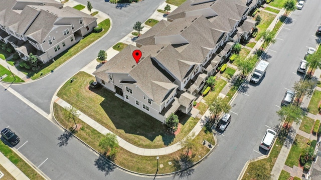 birds eye view of property with a residential view