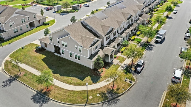 birds eye view of property with a residential view