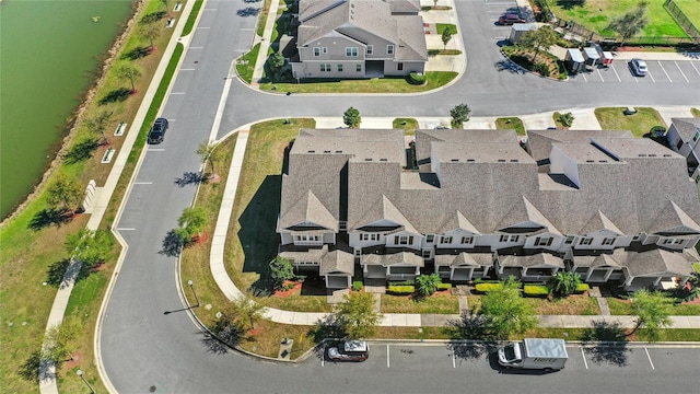 aerial view featuring a residential view and a water view