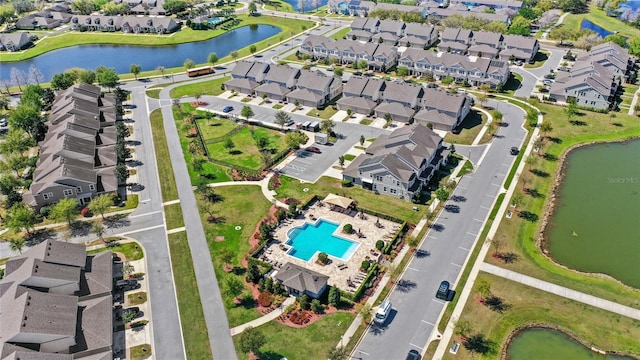 aerial view with a residential view and a water view