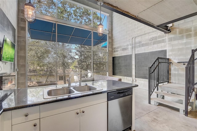 view of patio / terrace featuring a sink, a lanai, and exterior kitchen