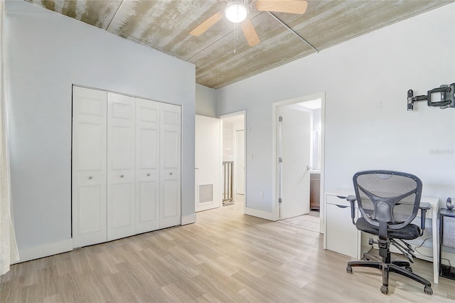 office area with ceiling fan, visible vents, and light wood-type flooring