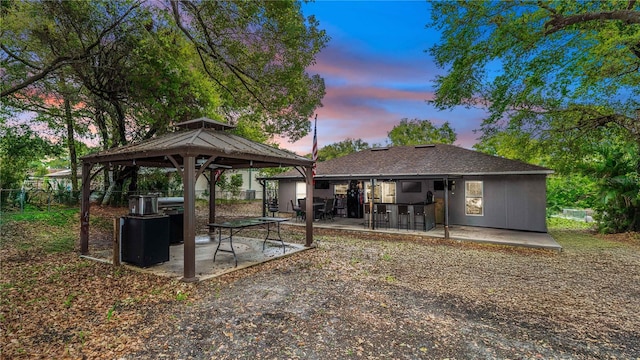 back of house with a gazebo, a patio, and fence