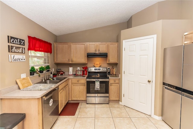 kitchen featuring light brown cabinets, exhaust hood, light tile patterned flooring, stainless steel appliances, and a sink