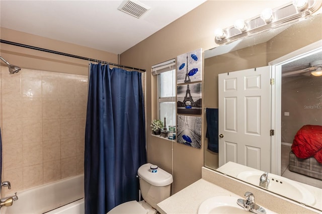 bathroom with visible vents, toilet, vanity, and shower / bath combination with curtain