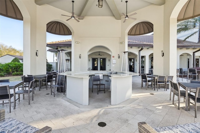 8959 Stinger Dr, Champions Gate, FL 33896 - view of patio / terrace featuring ceiling fan and outdoor dining space
