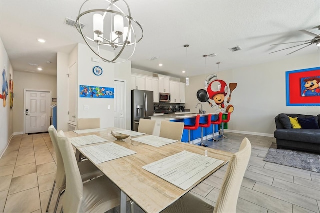 8959 Stinger Dr, Champions Gate, FL 33896 - dining room with a chandelier, recessed lighting, ceiling fan, and light tile patterned floors