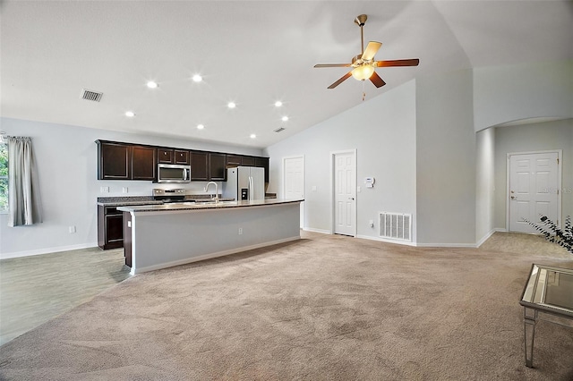 kitchen with arched walkways, visible vents, appliances with stainless steel finishes, and ceiling fan