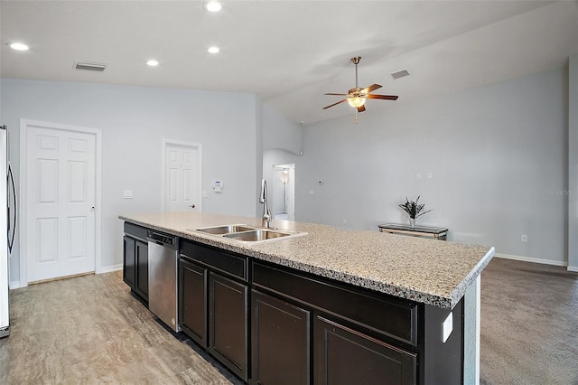 kitchen featuring a center island with sink, visible vents, ceiling fan, a sink, and appliances with stainless steel finishes