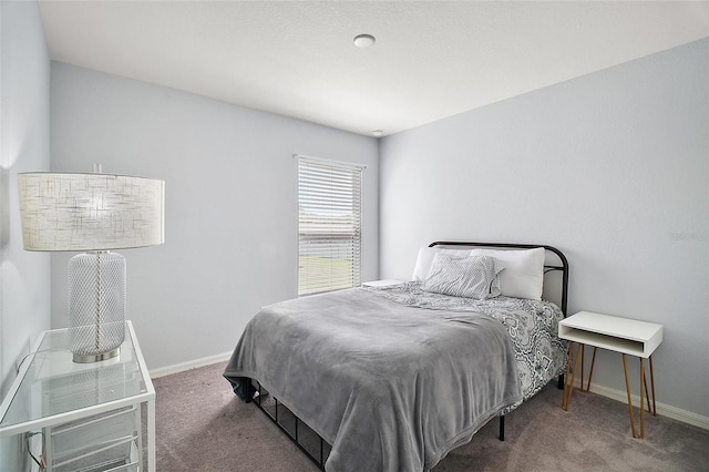 carpeted bedroom with baseboards