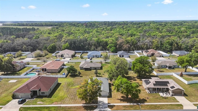 bird's eye view with a forest view and a residential view