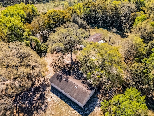 aerial view featuring a view of trees