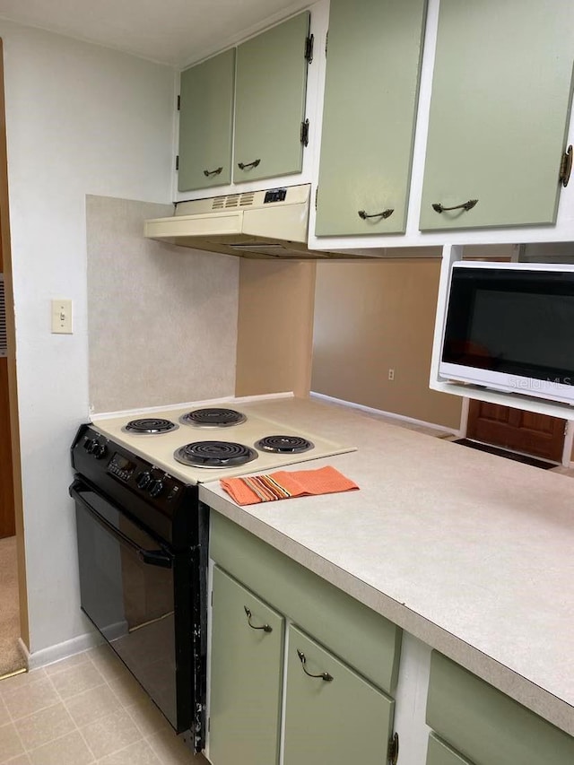 kitchen featuring under cabinet range hood, green cabinets, light countertops, and black electric range