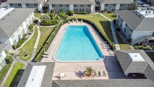 view of pool with a residential view