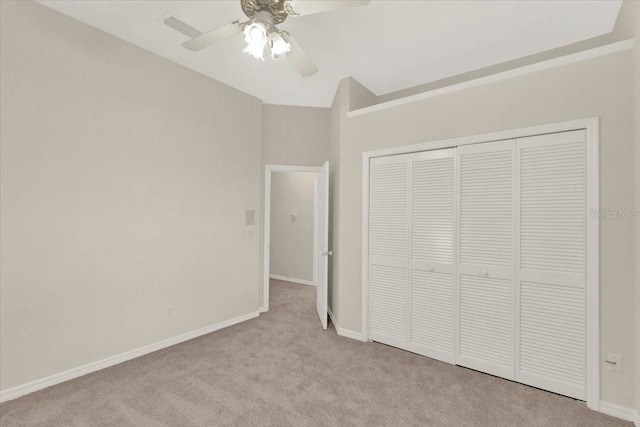 unfurnished bedroom with visible vents, a ceiling fan, a closet, carpet, and baseboards