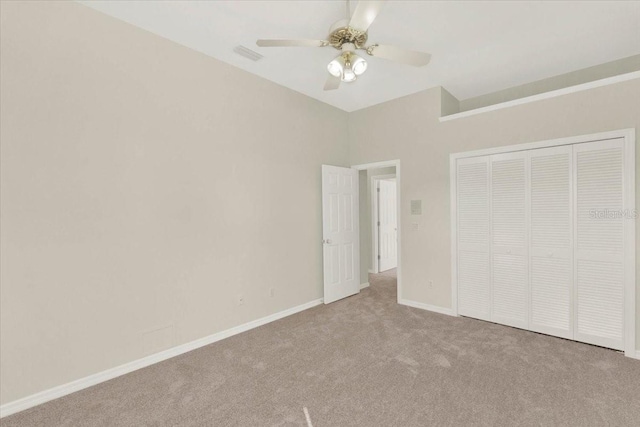 unfurnished bedroom featuring a ceiling fan, baseboards, visible vents, a closet, and carpet flooring