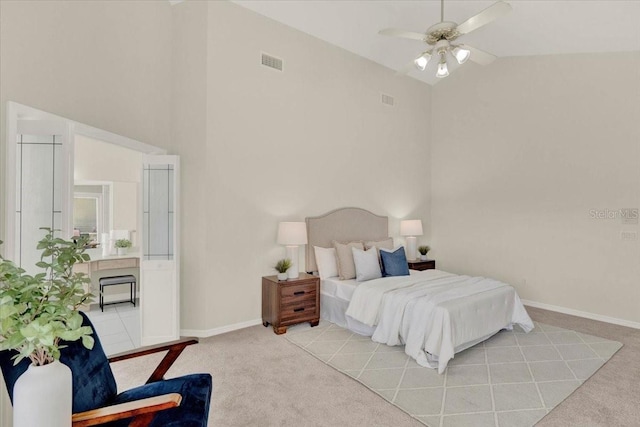 bedroom with visible vents, light colored carpet, baseboards, and ceiling fan