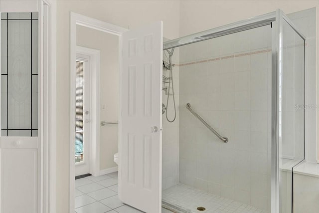 bathroom featuring a shower stall and tile patterned floors