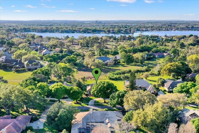 drone / aerial view featuring a residential view and a water view