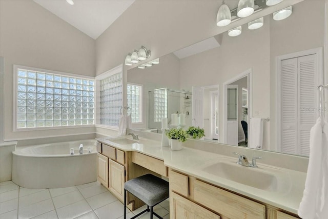 bathroom featuring a stall shower, vaulted ceiling, a closet, tile patterned floors, and a bath