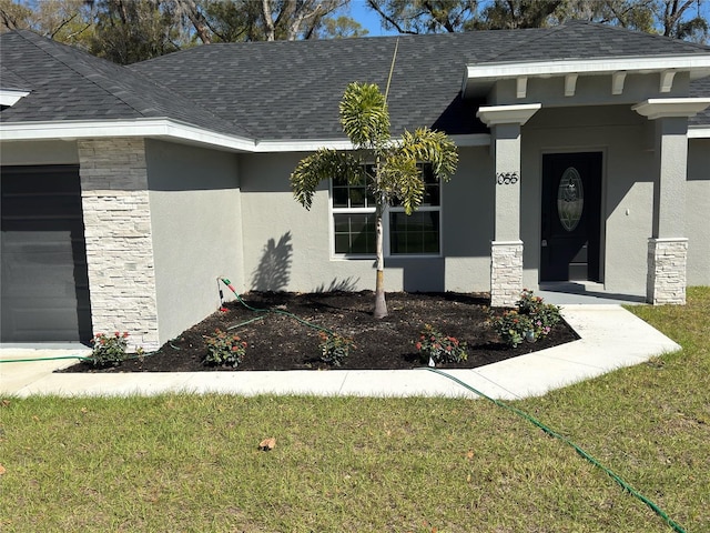 property entrance with stone siding, a garage, roof with shingles, and stucco siding