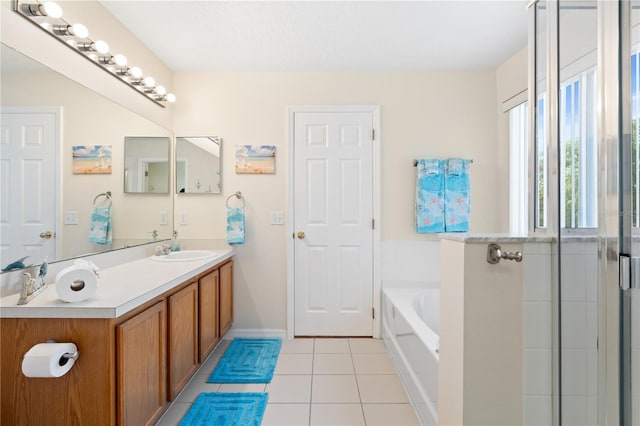 full bath with a shower with shower door, a garden tub, vanity, and tile patterned flooring