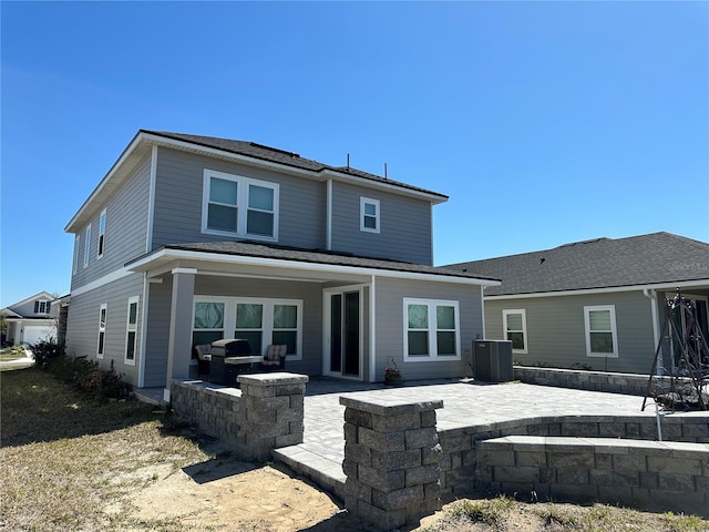 back of property featuring a patio area and central AC unit