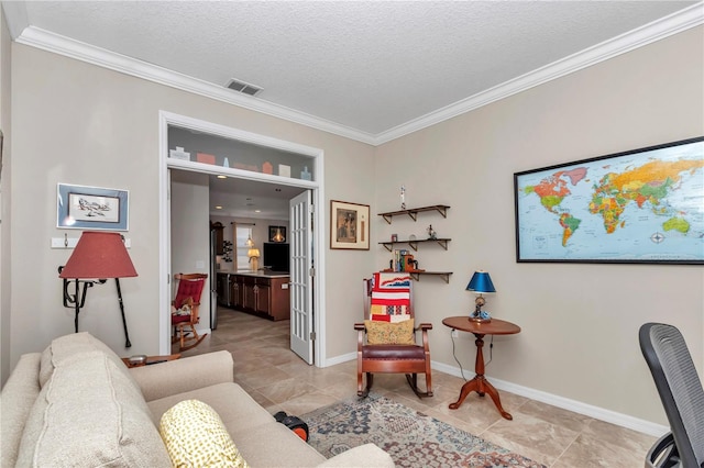 home office featuring visible vents, a textured ceiling, baseboards, and ornamental molding