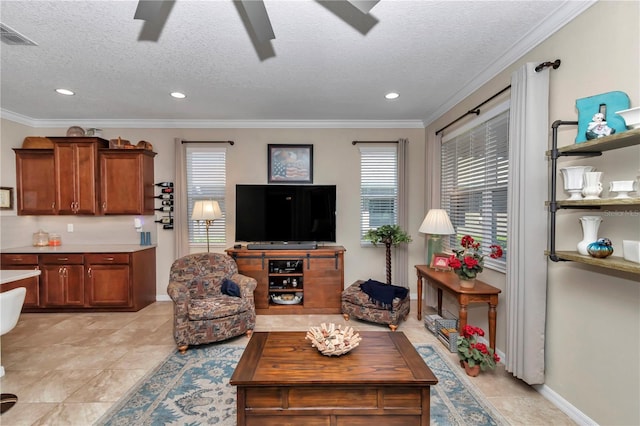 living area with visible vents, crown molding, baseboards, ceiling fan, and a textured ceiling