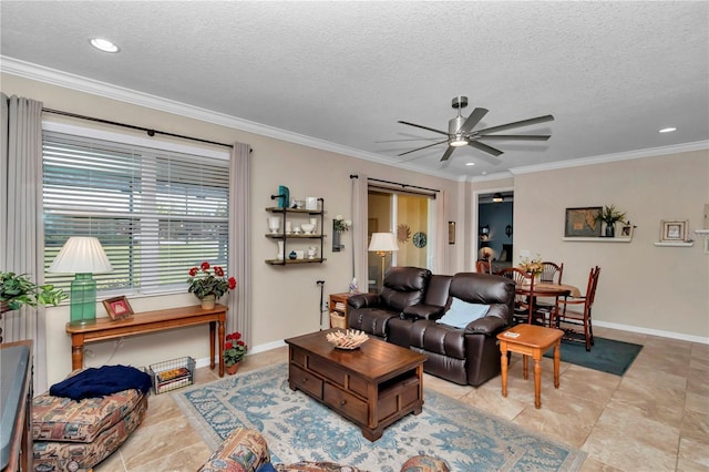 living room featuring a textured ceiling, a ceiling fan, baseboards, and ornamental molding